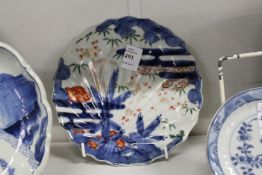 A small 18th century Imari plate with four character mark to the base.