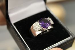 A decorative silver ring.