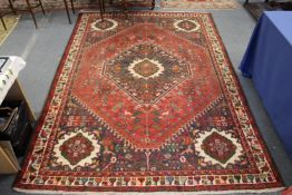 A Persian design carpet.