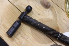 A carved wood walking stick.