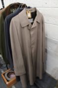 A gentlemen's Aquascutum beige coloured raincoat and similar navy raincoat.