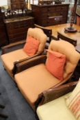 A pair of mahogany framed Bergere armchairs.