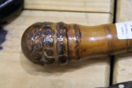A carved bamboo walking stick.