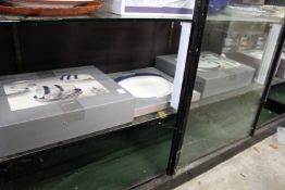 A quantity of dinner and tea ware, boxed as new.