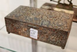 A Japanese metal cigarette box.