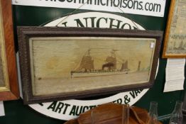 A 19th century woolwork picture of a steam sailing ship off the coast with a lighthouse, framed