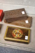 A decorative box together with two eastern carved wood boxes.
