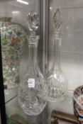 Two cut glass decanters.