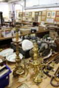 A large brass five branch chandelier and a gilt plaster lamp.