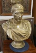 A painted plaster bust of Julius Caesar.