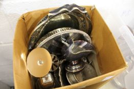 A small box of plated items.