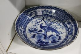 A Japanese circular blue and white bowl (faults).