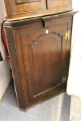 A 19th century oak hanging corner cupboard.
