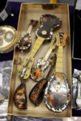 A good collection of tortoiseshell miniature mandolins and guitars.