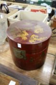 A Chinese red lacquer circular hinged box and cover.