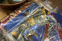 Four decoratively printed eastern textiles.