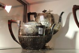 A Victorian silver teapot and matching coffee pot.