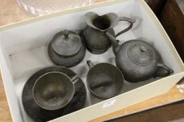 An eastern engraved metal tea for two service.