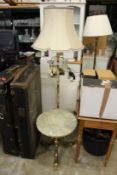 An onyx and brass occasional table and similar standard lamp.