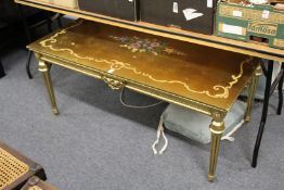 A decorative gilt wood coffee table.