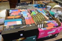 Four boxes of Harry Potter books and related items.