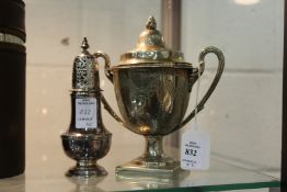 A silver baluster shaped sugar caster and a continental silver twin handled cup or sugar basket.