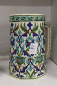 An Iznik style large pottery tankard.