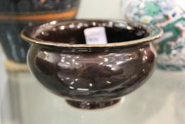 A Chinese dark grey glazed circular brush washer.