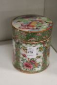 A Chinese Famille Rose circular box and cover (faults).
