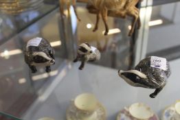 Three Beswick badgers.