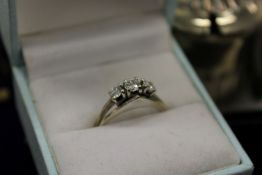 A white gold and diamond three stone ring.