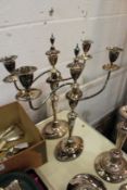 A pair of plated candelabra.
