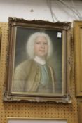 A portrait of a distinguished looking gentleman with a white wig in a decorative frame.