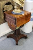 A good Regency rosewood drop flap sewing table on cluster column support with concave sided base.
