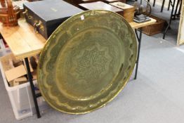 A large engraved brass eastern circular tray / table top.