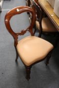 A set of six mahogany balloon back dining chairs.