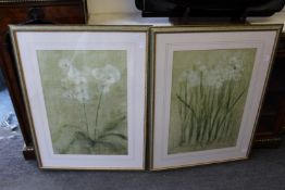 A pair of large floral prints.