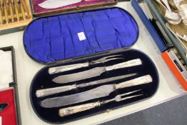 A cased silver handled carving set.