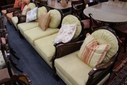 A mahogany framed three piece Bergere suite.