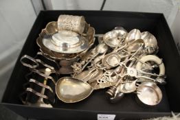 A large quantity of silver items to include spoons, sugar nips, toast rack etc.