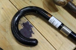 A collapsible walking stick.