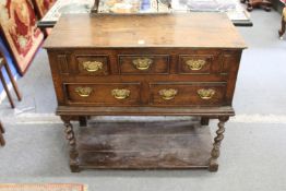 An unusual 18th century small oak pot board style dresser with an arrangement of five drawers on