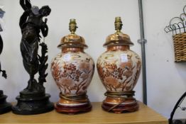 A pair of Chinese ginger jar style lamps.
