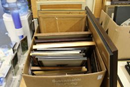 A quantity of paintings and prints.