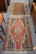 Two small old Persian rugs.