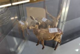 A Beswick fallow deer group to include stag, doe and fawn.