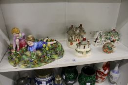 A large Crown Staffordshire porcelain group of two children sitting in a field of flowers together
