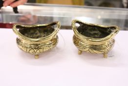 A pair of Chinese polished bronze censers.