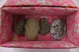 A collection of five Chinese carved jadeite pendants or roundel.