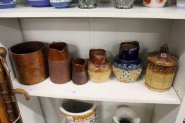 Doulton jugs, a salt glazed jar and cover and a wooden grain measure.